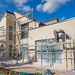 Scaffolding set up to paint the outside of a home